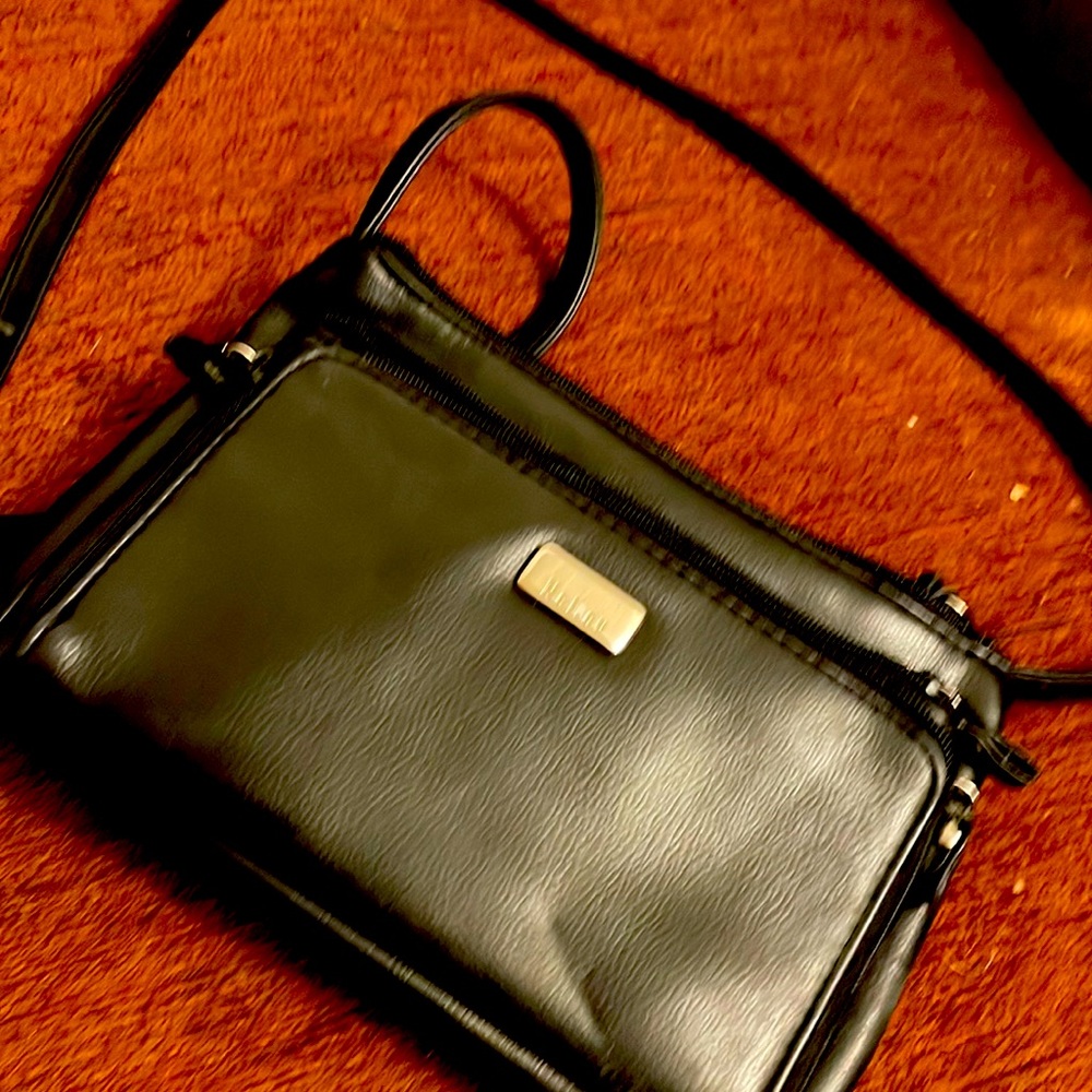 Four pockets including the inside pocket and there is a glasses holder too